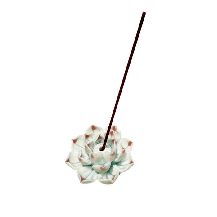 Pink ceramic lotus incense holder with incense
